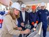 Ship sponsor Christina Calhoun Zubowicz writes her initials onto a steel plate that will be welded inside Calhoun (WMSL 759), the national security cutter named in honor of her grandfather, Charles L. Calhoun. Pictured with Zubowicz are (left to right) George Nungesser, Ingalls Shipbuilding Vice President of Program Management; Christopher Tanner, a structural welder at Ingalls; and Capt. Peter Morisseau, commanding officer, U.S. Coast Guard Project Resident Office Gulf Coast. Photo by Lance Dav