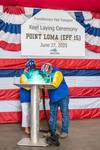 Ship sponsor Mrs. Elizabeth Asher, with the assistance of Perry Sullivan, a 17-year Austal USA veteran A-class welder, authenticated the keel by welding her initials into a keel plate that will be welded to the hull of the ship. Image courtesy Austal USA