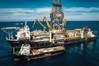 The four-kilometer airlift riser system installed upon the Hidden Gem is constructed from multiple sections of piping which must be sequentially lowered to the seafloor.
Image courtesy of TMC