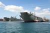 Australia’s second Landing Helicopter Dock (LHD) ship, HMAS Adelaide, arriving at its new home at Fleet Base East Garden Island, Sydney. (Photo courtesy of the RAN)