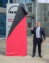 Uwe Lauber, CEO MAN Energy Solutions unveiling the new company name in the Augsburg Headquarter (Photo: MAN Energy Solutions)