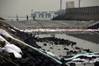 Workers clean up oil on a river of the Jiaozhou Bay after an oil pipeline exploded at the China Petroleum & Chemical Corp. plant in the city of Qingdao, east China's Shandong province, on November 23, 2013. (AFP/Getty Images)