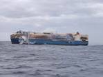 Tug Boats Spray Water on Blazing Ship Carrying Luxury Cars near Azores