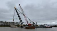Rock barge ACL 01700 split in half and sunk after grounding near Mile Marker 99 in Berwick, La. earlier this week. Salvage operations have continued day and night. (Photo Alexandria Preston / U.S. Coast Guard)