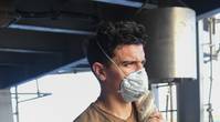 A U.S. Navy Seaman holds onto mooring line on the fantail of the aircraft carrier USS Theodore Roosevelt as the ship departs Apra Harbor May 21, 2020, after being sidelined in Guam due to a COVID-19 outbreak on board. (U.S. Navy photo by Erik Melgar)