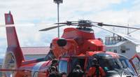Coast Guard rescue crew members transfer an unresponsive individual to local Emergency Medical Service personnel after recovering him the water near the Strait of Juan de Fuca on July 10, 2018. (Photo: U.S. Coast Guard)
