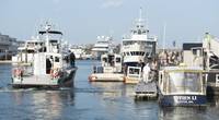 A Coast Guard Station Boston 45-foot response boat crew stands by at Long Wharf in Boston, Thursday, August 16 after responding to a collision between a water taxi and sailboat in Boston Harbor. (U.S. Coast Guard photo by Andrew Barresi)