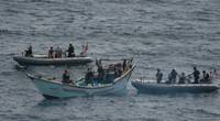 A visit, board, search and seizure team from the USS Jason Dunham (DDG 109) inspects a skiff found to be carrying a shipment of over 1,000 illicit weapons. (U.S. Navy photo by Matt Bodenner)