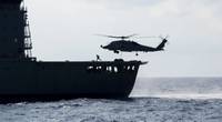 SOUTH CHINA SEA (May 7, 2019) An MH-60R Sea Hawk helicopter assigned to the "Easyriders" of Helicopter Maritime Strike Squadron (HSM) 37, Detachment 1, picks up pallets from the Military Sealift Command fleet replenishment oiler USNS Guadalupe (T-AO 200) during a replenishment-at-sea with the Arleigh Burke-class guided-missile destroyer USS Preble (DDG 88). Preble is deployed to the U.S 7th Fleet area of operations in support of security and stability in the Indo-Pacific region. (U.S. Navy photo
