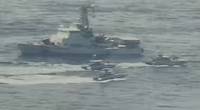 Iranian Islamic Revolutionary Guard Corps Navy (IRGCN) vessels cross the bows and sterns of U.S. military ships at close range while operating in international waters of the north Arabian Gulf. (U.S. Navy photo)