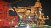 A Coast Guard Air Station New Orleans MH-60 Jayhawk lands on BP's oil platform Atlantis for a medevac, approximately 130 miles offshore from Port Fourchon, Louisiana, March 17, 2023. The patient had a reported eye injury and was brought to University Medical Center in stable condition. (U.S. Coast Guard photo by Coast Guard Air Station New Orleans)