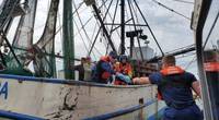 Coast Guard Station Port O'Connor boatcrew members assist in transferring a mariner in need of medical attention during a medevac offshore Matagorda Bay near Port O'Connor, Texas, February 23, 2020. The mariner was reported to be in stable condition. (U.S. Coast Guard photo by Station Port O'Connor)