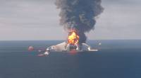 Deepwater Horizon burning in April 2010. Image by US Coast Guard
