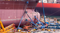 Illustration - A Shipyard in South Korea - Credit:Angelika Bentin/AdobeStock
