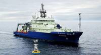 The research vessel Neil Armstrong arrived to recover a surface mooring that is part of the OOI Global Array in the Irminger Sea south of Greenland in 2016. (Photo by James Kuo, Woods Hole Oceanographic Institution)
