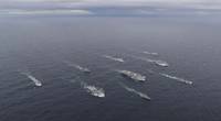 Aircraft carrier HMS Queen Elizabeth has achieved Initial Operating Capability (IOC).
Photo shows HMS Queen Elizabeth and her Carrier Strike Group at an exercise in October 2020: Photo by LPhot Belinda Alker