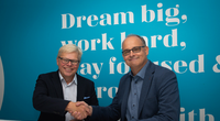 CADMATIC CEO Jukka Rantala (left) and Kymdata CEO Jyrki Metsola (right) shake hands on the acquisition agreement.
(Photo: Cadmatic)