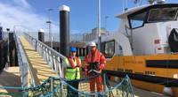 Captain Jeff Gaskin, Aberdeen Harbour Master, and Adam Ezzamel, EOWDC Project Director, Vattenfall, on the new pontoon Photo Aberdeen Harbor )