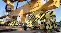 The crane BASIS is installed in the saddle bracket between the sill beam and main equalizer beam. There are four corners for each crane. This photo shows two corners on the waterside; the two corners on the landside are not shown. Photo courtesy Casper, Phillips & Associates Inc. (CPA).