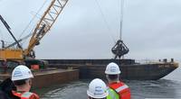 Left to right: MD Secretary of Transportation Gregory Slater, MD Governor Larry Hogan, and MPA-Port of Baltimore Executive Director William Doyle observe dredging operations at Seagirt Marine Terminal for a new 50-ft. berth in March 2021. (Photo: Maryland Port Administration)