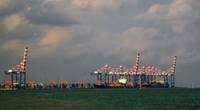 Panorama of Djibouti port with ships and cargo crane - Credit: homocosmicos/AdobeStock