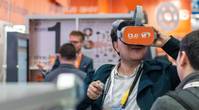 At trade shows, stand visitors can travel to the igus factory within seconds and gain an impression of the test laboratory, the injection-molding shop and the assembly section. (Photo: igus GmbH)