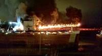 By 8:20 p.m. St. Clair's cargo conveyor boom had become completely engulfed in flames (Photo: Great Lakes Trader chief engineer / NTSB)