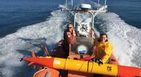 MBARI researchers head out into Monterey Bay to deploy a long-range autonomous underwater vehicle (LR-AUV), an underwater robot that is programmed at the surface and then travels underwater for hundreds of miles, measuring water chemistry and collecting water samples as it goes. Credit: Brian Kieft (c) 2015 MBARI