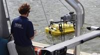 NOAA scientist operates an autonomous surface vehicle in the Port of Gulfport, Miss., during the Commander, Naval Meteorology and Oceanography Command’s Advanced Naval Technology Exercise on Nov. 6, 2019, to test and evaluate new maritime technologies. (CNMOC)