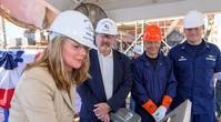 Ship sponsor Christina Calhoun Zubowicz writes her initials onto a steel plate that will be welded inside Calhoun (WMSL 759), the national security cutter named in honor of her grandfather, Charles L. Calhoun. Pictured with Zubowicz are (left to right) George Nungesser, Ingalls Shipbuilding Vice President of Program Management; Christopher Tanner, a structural welder at Ingalls; and Capt. Peter Morisseau, commanding officer, U.S. Coast Guard Project Resident Office Gulf Coast. Photo by Lance Dav