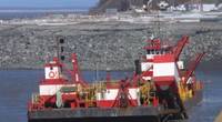 The Westport, a red and white hopper dredge operated by Manson Construction, dredges near the Port of Alaska on April 3, 2019. From May 1 to Nov. 1 each year, the U.S. Army Corps of Engineers removes built-up sediment from the seafloor near the Port of Alaska to maintain shipping channels and dock access. An estimated 50 percent of all goods entering Alaska come through this port. (Photo: U.S. Army)