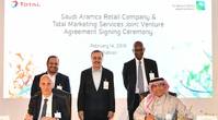 Group photo of Saudi Aramco management and Total management