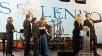 (L-R) Captain Serena Melani; Regent Seven Seas Cruises’ President and Chief Executive Officer, Jason Montague; President and Chief Executive Officer of Norwegian Cruise Line Holdings Ltd., Frank Del Rio; Seven Seas Splendor Godmother Christie Brinkley; and Cruise Director of Seven Seas Splendor, John Barron watch as the iconic champagne smash officially christens Seven Seas Splendor. (Photo: Business Wire)