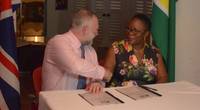 National Hydrographer of the UK Hydrographic Office, Rear Admiral Tim Lowe and Director General of the Maritime Administration Department, Claudette Rogers during the signing of the agreement. Photo: DPI Guyana