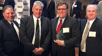 Buck Younger, third from left, was named the Marine Engineer/Naval Architect of the Year. Attending the awards presentation were VT Halter Marine’s Alvin Erkhart, Vice President of Production, Kevin Amis, Executive Vice President of Operations, and Rob Mullins, Deputy President. (Photo: VT Halter)