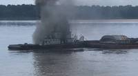 The vessel Jacob Kyle Rusthoven caught fire on the lower Mississippi River near West Helena, Ark., on September 12. (U.S. Coast Guard photo by Brandon Giles)