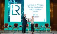 Andy McKeran, LR Chief Commercial Officer presents the AIP certificate to Kaisa Nikulainen, Rotoboost CEO. (Photo: Lloyd’s Register)