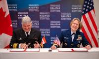 Mario Pelletier, Commissioner of the Canadian Coast Guard and Admiral Linda Fagan, Commandant, United States Coast Guard signing the renewed Canada-United States Joint Marine Pollution Contingency Plan. (Photo: U.S. Coast Guard)