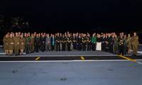 Senior government and military officials from 19 participating nations stand together as part of the Exercise Talisman Sabre 25 Opening Ceremony event onboard HMAS Adelaide, Sydney, New South Wales.
