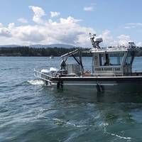 24 Workskiff M Series multi-mission vessel with walk around pilot house for the Tulalip Indian Fish and Game Agency for fisheries management, law enforcement, search and rescue and fire fighting. Naval architecture and marine engineering by Boksa Marine Design.