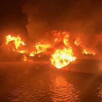 A 36-foot fishing vessel ablaze near Dauphin Island, Ala. (U.S. Coast Guard photo)