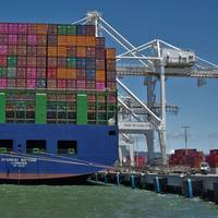 A boxship discharges cargo at the Port of Oakland (c) Port of Oakland