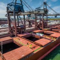 A bulk carrier loads alongside a grain berth. (c) Stock87 / Adobestock