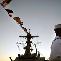 A crew member of the newly commissioned guided missile destroyer USS Sterett (DDG 104) stands at parade rest after being given the order to man the ship and bring her to life by the ship sponsor Michelle Sterett-Bernson. (U.S. Navy photo by Mass Communication Specialist 2nd Class Kevin S. O'Brien/Released)