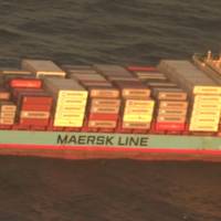 A crewmember burned by an engine room blast aboard Danish-flagged Laura Maersk off the U.S. East Coast was transported by helicopter to a hospital in Norfolk, Va. (U.S. Coast Guard video by Air Station Elizabeth City)