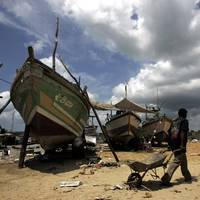 A fishing trawler damaged by the December 2004 tsunami under repairs at the Kudewella boat repair centre in Sri Lanka with assistance from FAO. Photo: FAO/Prakash Singh
