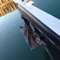 A gash in the hull of a barge is the result of a collision between the tugboats Yellowfin and Capt. Warren that occurred in the Corpus Christi ship channel, Dec. 17, 2013. Coast Guard Sector Corpus Christi has dispatched marine investigators to determine the cause of the collision. (U.S. Coast Guard photo)
