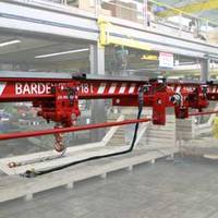 A hydraulically operated overhead crane with a hoist lift capacity of 18 tons, manufactured by J D Neuhaus for Bardex Corporation