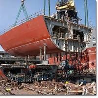 A section of the hull of the USNS Medgar Evers (T-AKE 13) lowered into place in January of 2011.