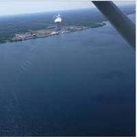 A sheen is visible from the air in Lake Ontario near the Fitzpatrick Nuclear Power Plant in Scriba, New York, approximately 10 miles northeast of Oswego, New York, June 26, 2016. A Coast Guard Auxiliary air crew noticed the sheen during a flight and reported it to Coast Guard Sector Buffalo. (U.S. Coast Guard photo)